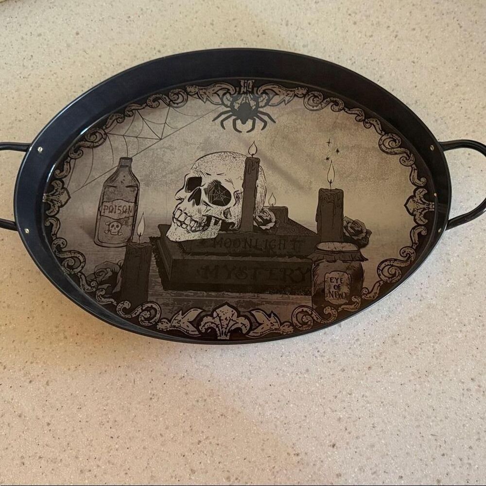 Oval tray with a skull and spider design. Ideal for spooky decor.